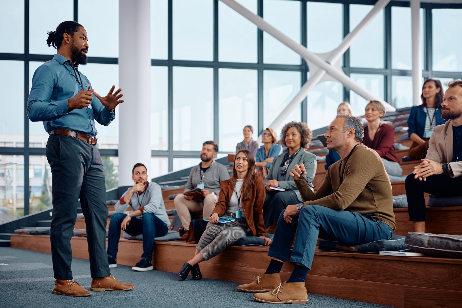 https://media.gettyimages.com/id/1783744325/photo/black-businessman-talking-to-large-group-of-entrepreneurs-during-an-education-event-in.jpg?b=1&s=2048x2048&w=0&k=20&c=by8tuABuRwd4UZrEtoolNio-AUwfOZi966oBo9Fnt84=
