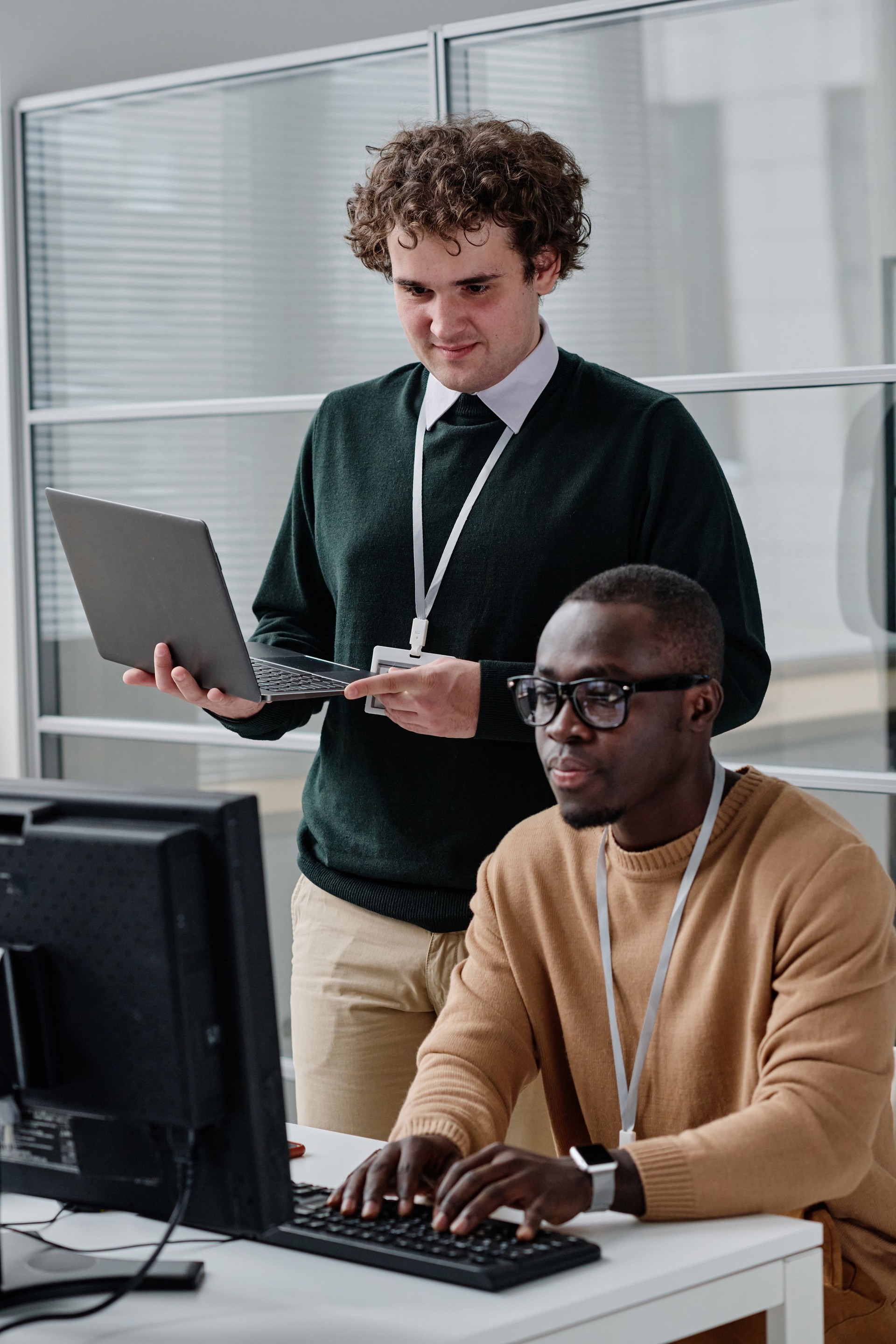 Colleagues working with software in team